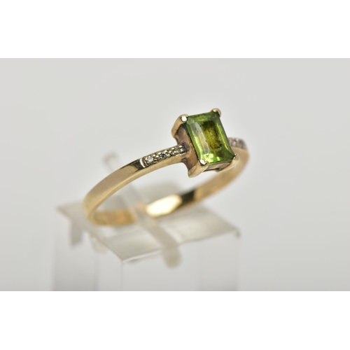 12 - A 9CT GOLD PERIDOT AND DIAMOND DRESS RING, the rectangular shape peridot, within a claw setting, to ... 