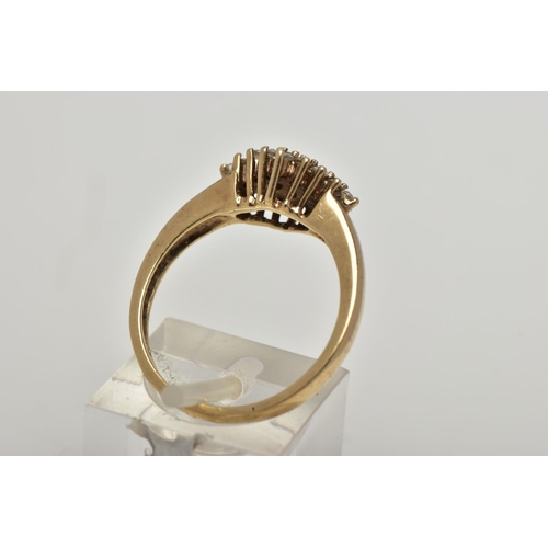 25 - A 9CT GOLD CLUSTER RING, the cluster of a marquise design set with colourless circular cut, cubic zi... 