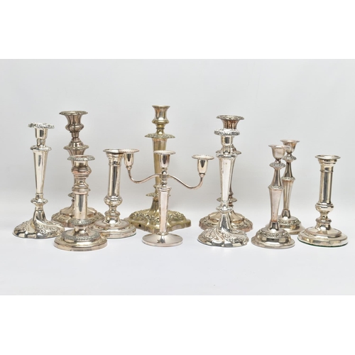 56 - A BOX OF ASSORTED WHITE METAL CANDLE STICKS, eleven candle sticks of various styles, all with weight... 