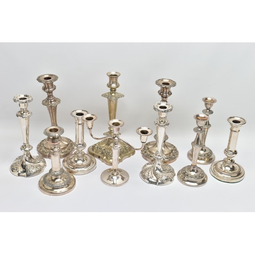 56 - A BOX OF ASSORTED WHITE METAL CANDLE STICKS, eleven candle sticks of various styles, all with weight... 