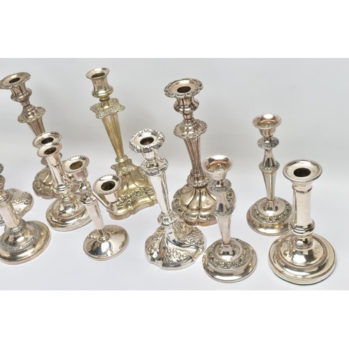 56 - A BOX OF ASSORTED WHITE METAL CANDLE STICKS, eleven candle sticks of various styles, all with weight... 
