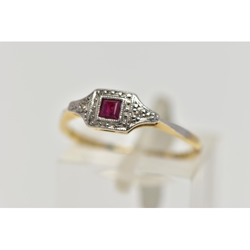 71 - A YELLOW METAL RUBY AND DIAMOND RING, art deco style ring set with a square cut ruby, flanked with s... 