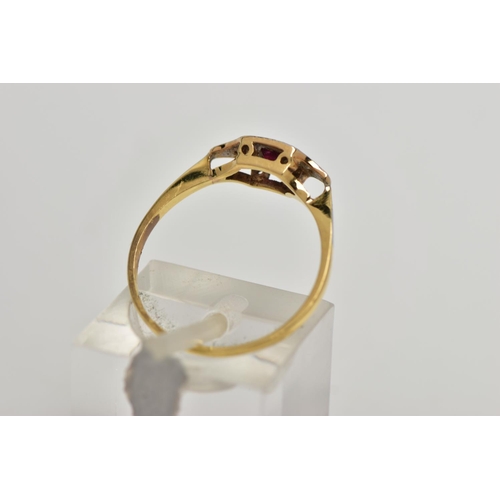 71 - A YELLOW METAL RUBY AND DIAMOND RING, art deco style ring set with a square cut ruby, flanked with s... 