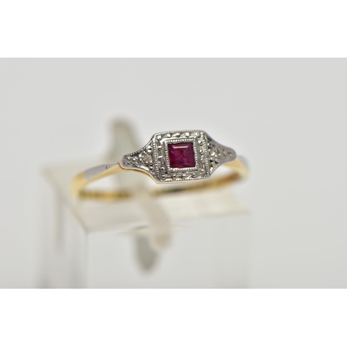 71 - A YELLOW METAL RUBY AND DIAMOND RING, art deco style ring set with a square cut ruby, flanked with s... 