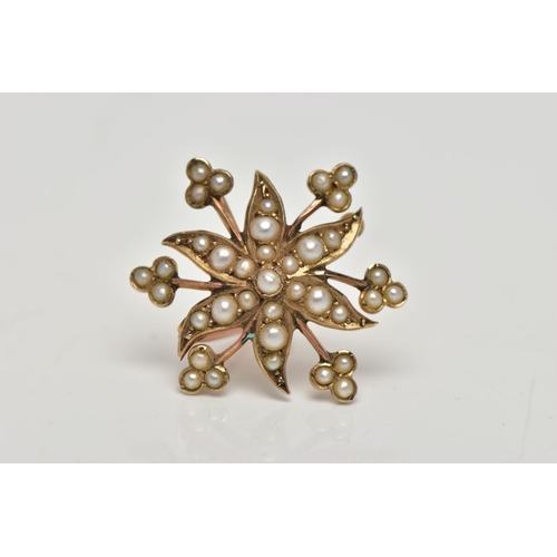 72 - A YELLOW METAL BROOCH/PENDANT, in the form of a flower, set with split pearls, fitted to the reverse... 