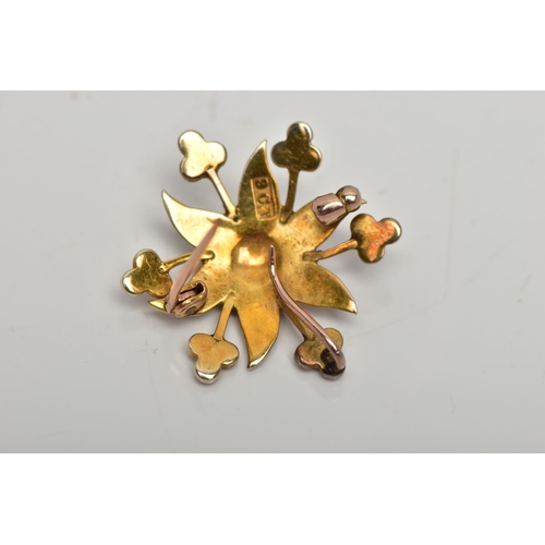 72 - A YELLOW METAL BROOCH/PENDANT, in the form of a flower, set with split pearls, fitted to the reverse... 