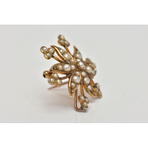 72 - A YELLOW METAL BROOCH/PENDANT, in the form of a flower, set with split pearls, fitted to the reverse... 
