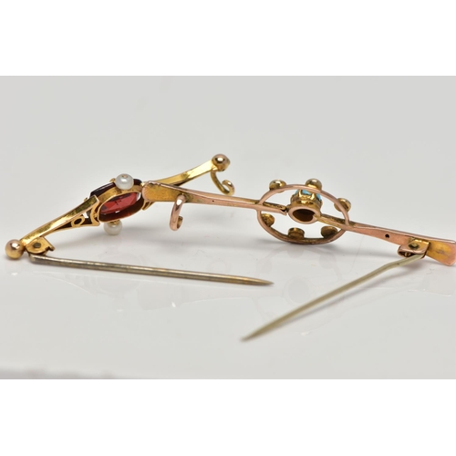 73 - TWO YELLOW METAL BAR BROOCHES, the first set with a central turquoise cabochon, within an openwork c... 