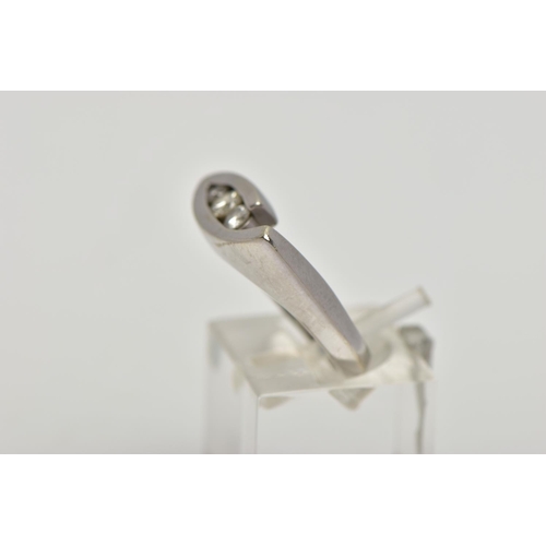 89 - A WHITE METAL DIAMOND RING, the ring head of an abstract lozenge shape, set with three graduated rou... 