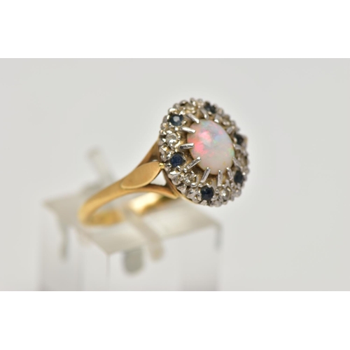 92 - AN 18CT GOLD, OPAL, SAPPHIRE AND DIAMOND CLUSTER RING, of an oval form centring on a twelve claw set... 