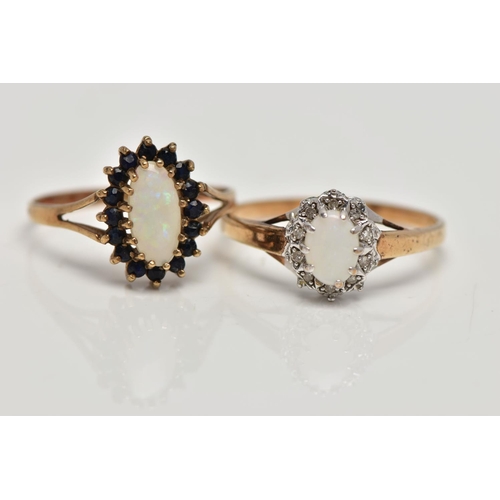 93 - TWO 9CT GOLD CLUSTER RINGS, the first of an elongated oval opal within a surround of circular cut bl... 