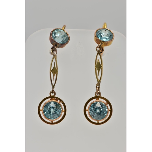 95 - A PAIR OF YELLOW METAL, ZIRCON DROP EARRINGS, each earring is set with two circular cut blue zircons... 