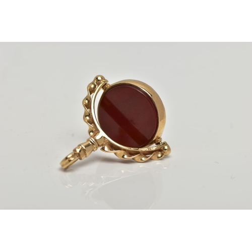 97 - A 9CT GOLD HARDSTONE SWIVEL FOB, the bloodstone and carnelian circular panels, rotating to the scrol... 