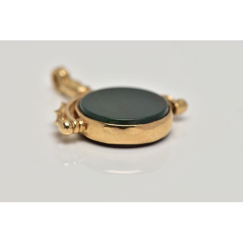97 - A 9CT GOLD HARDSTONE SWIVEL FOB, the bloodstone and carnelian circular panels, rotating to the scrol... 