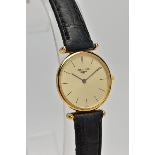 10 - A LADIES 'LONGINES' WRISTWATCH, quartz movement, round champagne dial, signed 'Longines Swiss made',... 