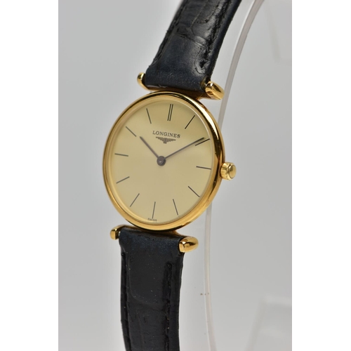 10 - A LADIES 'LONGINES' WRISTWATCH, quartz movement, round champagne dial, signed 'Longines Swiss made',... 