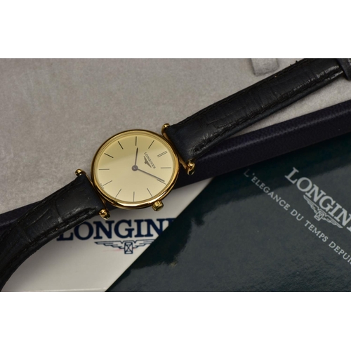 10 - A LADIES 'LONGINES' WRISTWATCH, quartz movement, round champagne dial, signed 'Longines Swiss made',... 