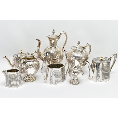 124 - TWO WHITE METAL TEA SETS, the first comprising of a coffee pot, a tea pot, milk jug and sugar bowl, ... 