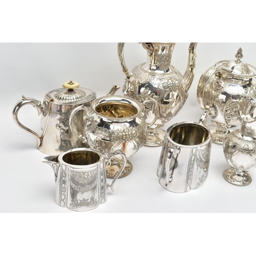 124 - TWO WHITE METAL TEA SETS, the first comprising of a coffee pot, a tea pot, milk jug and sugar bowl, ... 