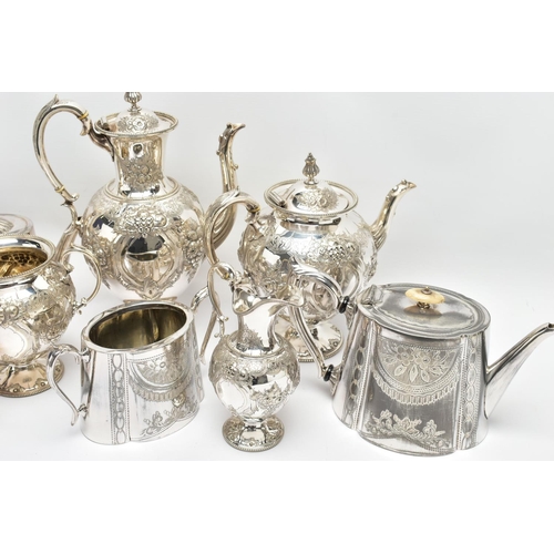 124 - TWO WHITE METAL TEA SETS, the first comprising of a coffee pot, a tea pot, milk jug and sugar bowl, ... 