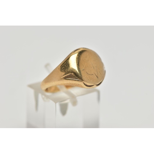 22 - A 9CT GOLD SIGNET RING, oval signet with worn engraving, textured shoulders leading onto a tapering ... 