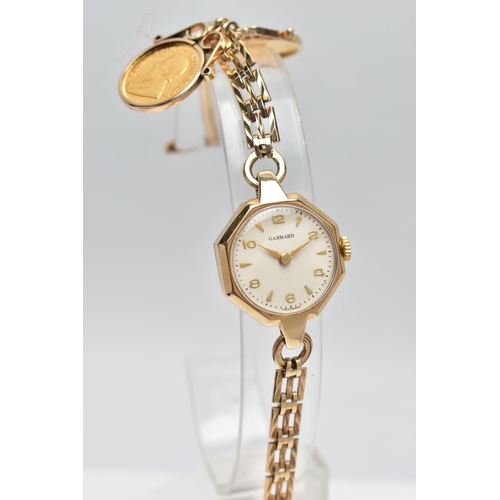 31 - A GARRARD 9CT GOLD MANUAL WIND WRISTWATCH TOGETHER WITH TWO MOUNTED 1/10 OZ KRUGERRAND COINS, the wa... 