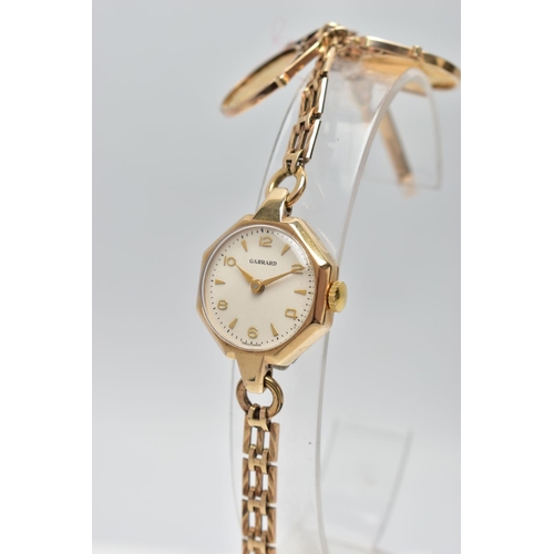 31 - A GARRARD 9CT GOLD MANUAL WIND WRISTWATCH TOGETHER WITH TWO MOUNTED 1/10 OZ KRUGERRAND COINS, the wa... 