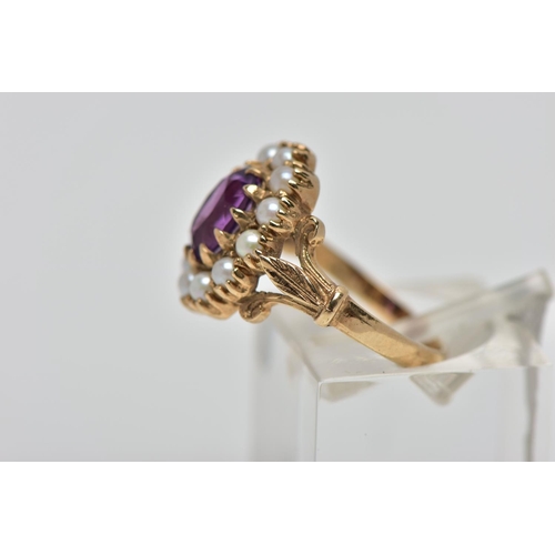 38 - A 9CT GOLD AMETHYST AND SEED PEARL CLUSTER RING, the oval cut amethyst within claw setting to the se... 