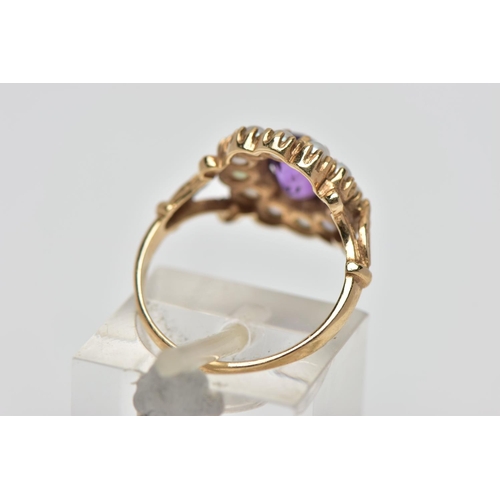 38 - A 9CT GOLD AMETHYST AND SEED PEARL CLUSTER RING, the oval cut amethyst within claw setting to the se... 