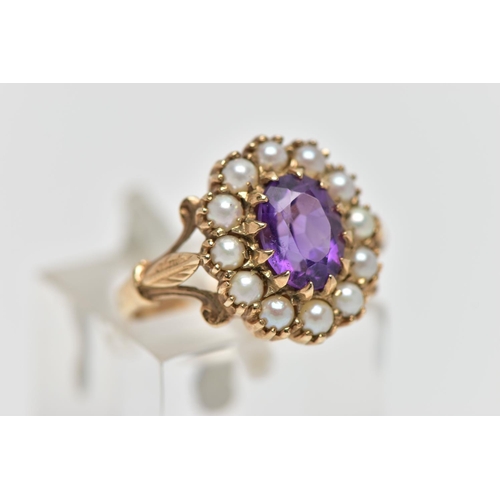 38 - A 9CT GOLD AMETHYST AND SEED PEARL CLUSTER RING, the oval cut amethyst within claw setting to the se... 