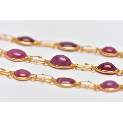 39 - A YELLOW METAL AND RUBY SPECTACLE SET BRACELET, comprised of twelve slightly graduated oval cabochon... 