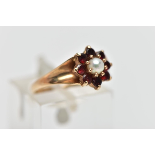 42 - A 9CT GOLD CULTURED PEARL AND GARNET CLUSTER RING, the claw set cultured pearl, with circular cut ga... 