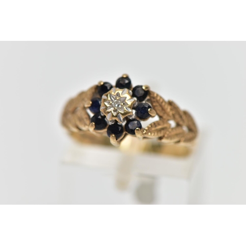 46 - A 9CT GOLD DIAMOND AND SAPPHIRE CLUSTER RING, the illusion set single cut diamond, within a circular... 