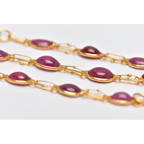 49 - A YELLOW METAL AND RUBY SPECTACLE SET BRACELET, comprised of eleven slightly graduated oval cabochon... 