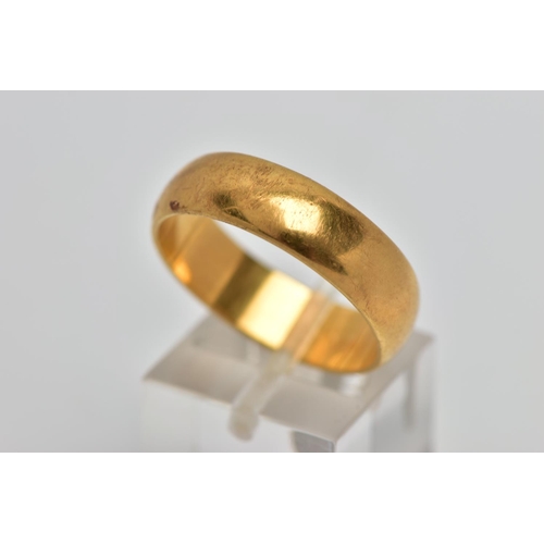 58 - A YELLOW METAL WIDE BAND RING, plain polished wide band, approximate width 6.2mm, stamped '18ct', wi... 