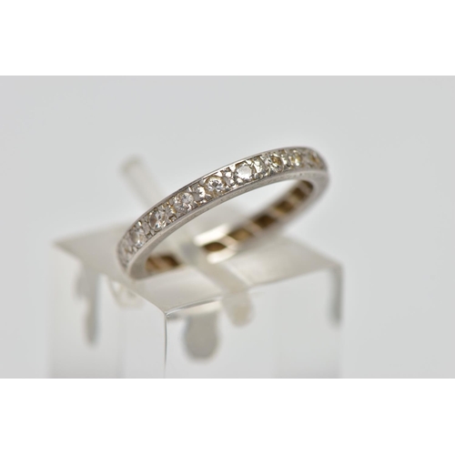 59 - A WHITE METAL FULL ETERNITY BAND, set with round brilliant cut diamonds, estimated total diamond wei... 