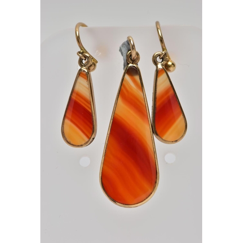 7 - A PAIR OF 9CT GOLD AGATE DROP EARRINGS AND PENDANT SET, each earring designed with a pear shape oran... 