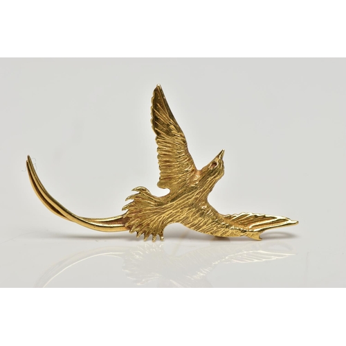 8 - A YELLOW METAL BIRD BROOCH PENDANT, a small brooch depicting a long tailed bird, approximate wing sp... 