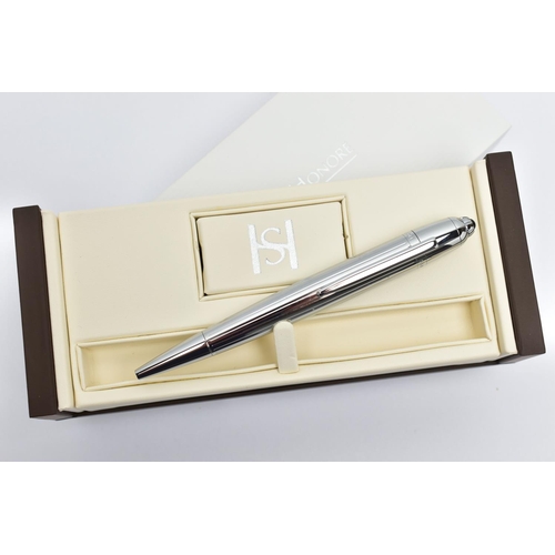 83 - A SAINT HONORE BALLPOINT PEN, a white metal twist weighted pen, detailed with a linear grooved patte... 