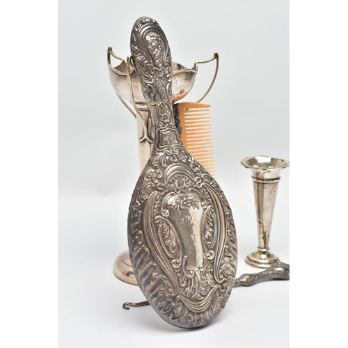 95 - A SELECTION OF EARLY TO MID 20TH CENTURY SILVER, to include a scroll and floral embossed hand mirror... 