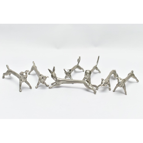 96 - SEVEN WHITE METAL NOVELTY KNIFE RESTS, depicting various animals to include a hare, dog and fox, wit... 