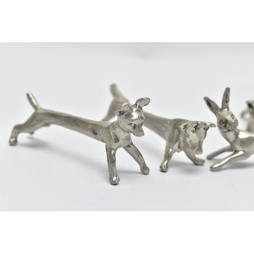 96 - SEVEN WHITE METAL NOVELTY KNIFE RESTS, depicting various animals to include a hare, dog and fox, wit... 