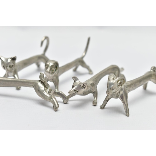 96 - SEVEN WHITE METAL NOVELTY KNIFE RESTS, depicting various animals to include a hare, dog and fox, wit... 