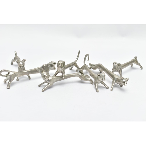 96 - SEVEN WHITE METAL NOVELTY KNIFE RESTS, depicting various animals to include a hare, dog and fox, wit... 