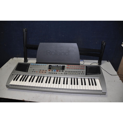 1273 - A ROLAND EM-15 ELECTRIC KEYBOARD with sheet music holder and keyboard stand (PAT pass and working)