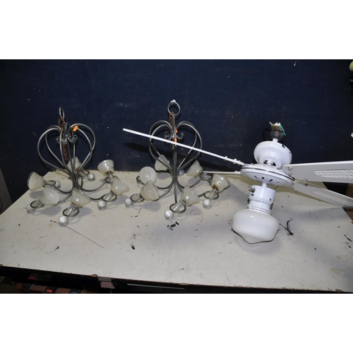 1315 - TWO METAL CHANDELLIER with glass bell shaped wax inserts along with a unbranded ceiling fan and ligh... 