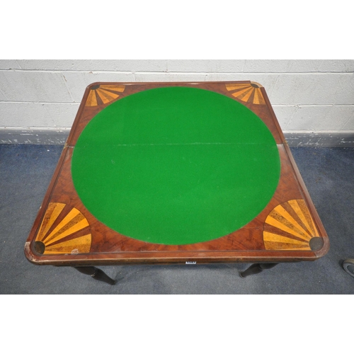 1583 - AN EARLY 20TH CENTURY WALNUT FOLD OVER GAMES TABLE, with circular green baize, on tuned legs. 86cm s... 