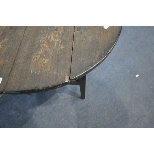 1587 - A GEORGIAN OAK CIRCULAR CRICKET TABLE, on  tapered legs, united by an undershelf, diameter 57cm x he... 