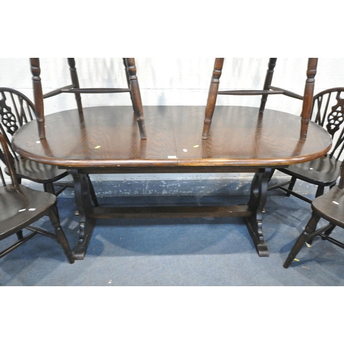 1588 - AN OAK TRESTLE DINING TABLE, length 169cm x depth 89cm x height 76cm, along with a matched set of ei... 