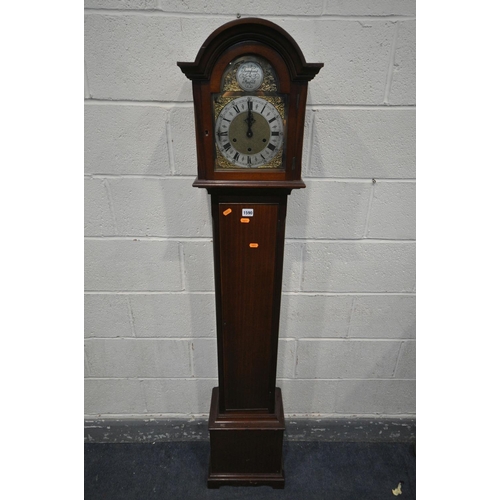 1590 - A 20TH CENTURY MAHOGANY CHIMING GRANDAUGHTER CLOCK, the arched door enclosing a brass and silvered 7... 